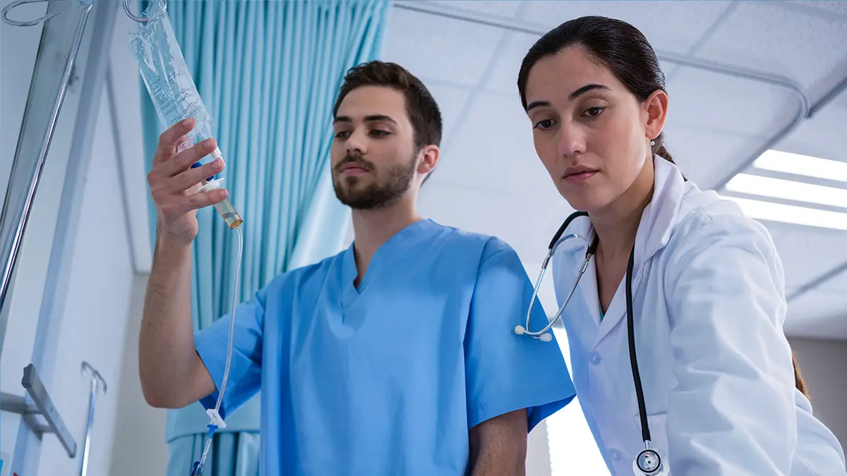 Two medical professionals are depicted in a clinical setting.